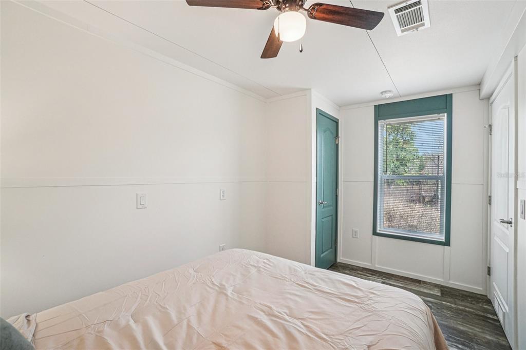 808 Southwest 124th Lane Webster, FL 33597 - Photo 15 of 18 a bedroom with a bed and a window