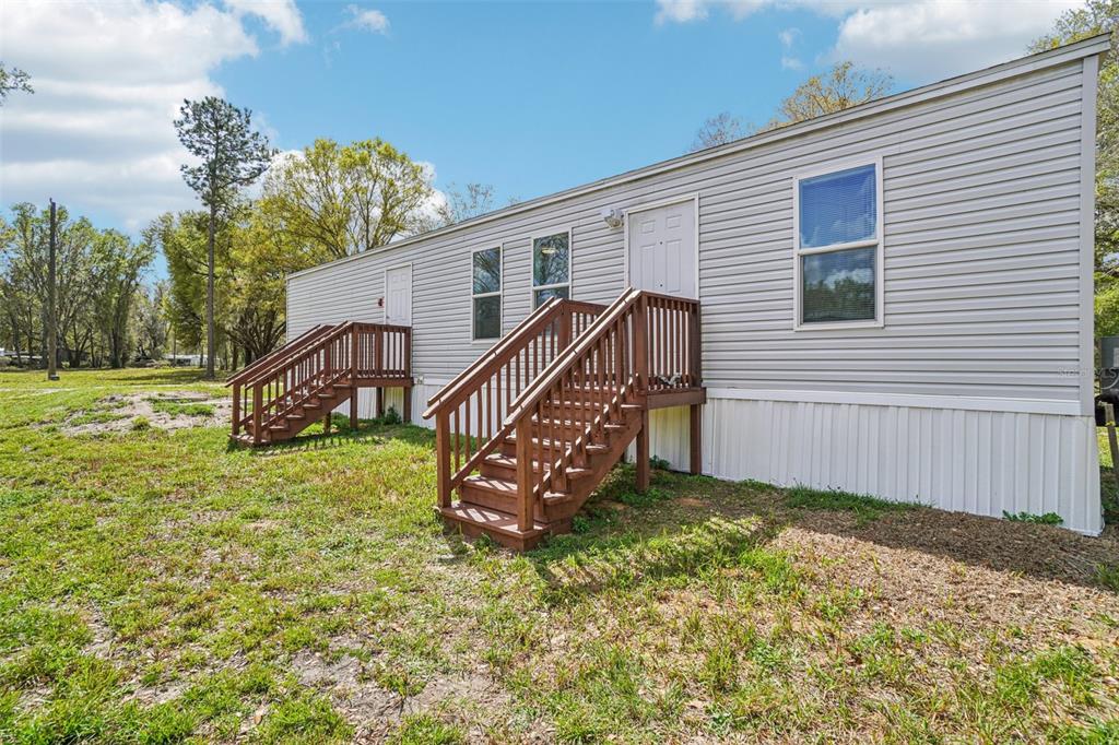808 Southwest 124th Lane Webster, FL 33597 - Photo 18 of 18 a view of a house with a yard