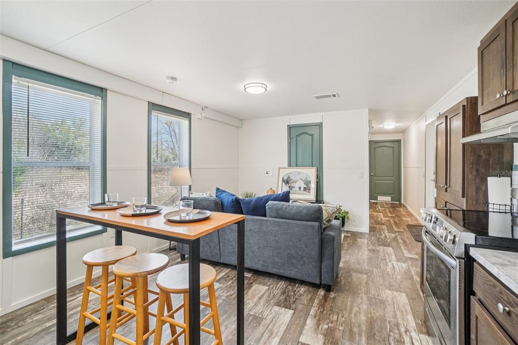 808 Southwest 124th Lane Webster, FL 33597 - Photo 5 of 18 a dining room with furniture and wooden floor
