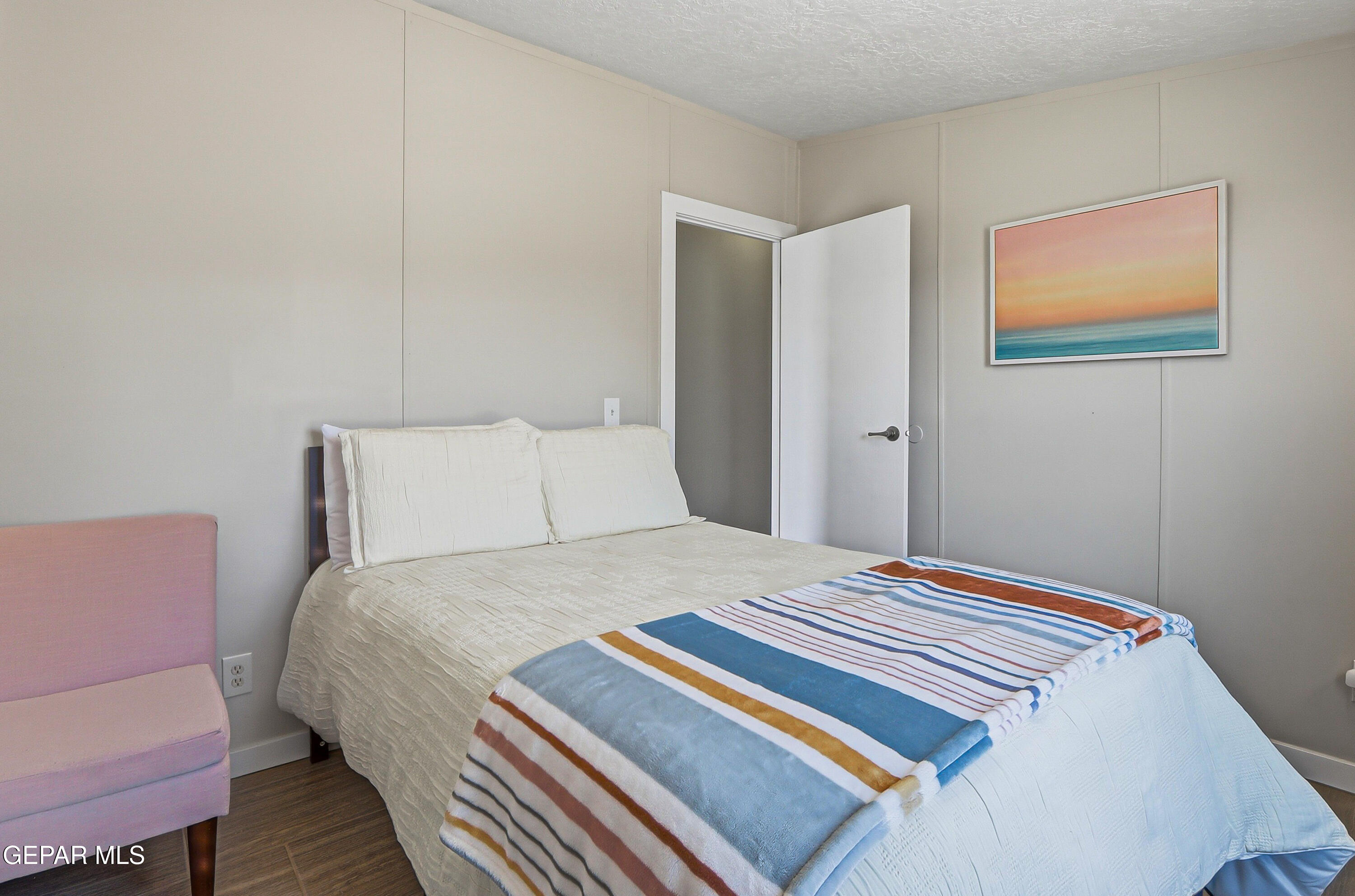 2901 Cook Street Truth or Consequences, NM 87901 - Photo 26 of 31 a bedroom with a bed and a painting on the wall