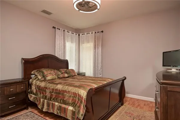 a bedroom with a bed and tv