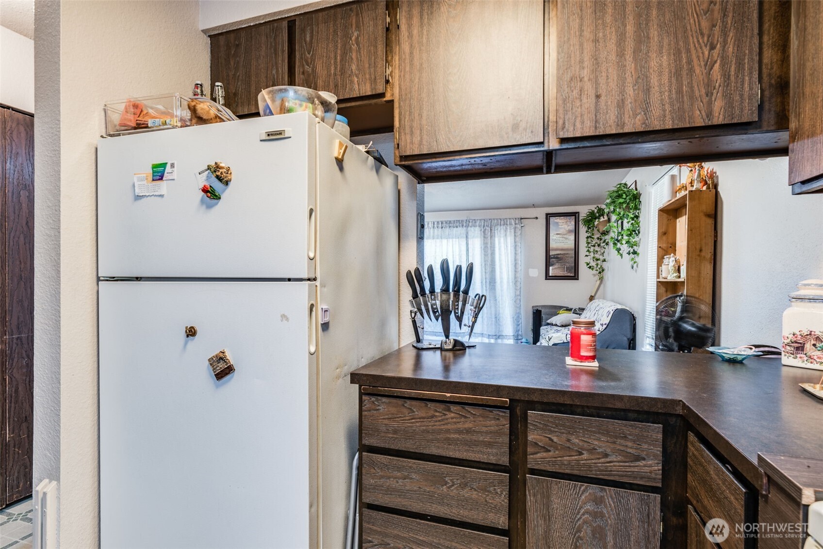 1602 Delaware Street Longview, WA 98632 - Photo 14 of 40 a white refrigerator freezer sitting inside of a kitchen