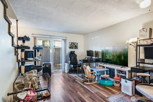 a living room filled with furniture and a flat screen tv