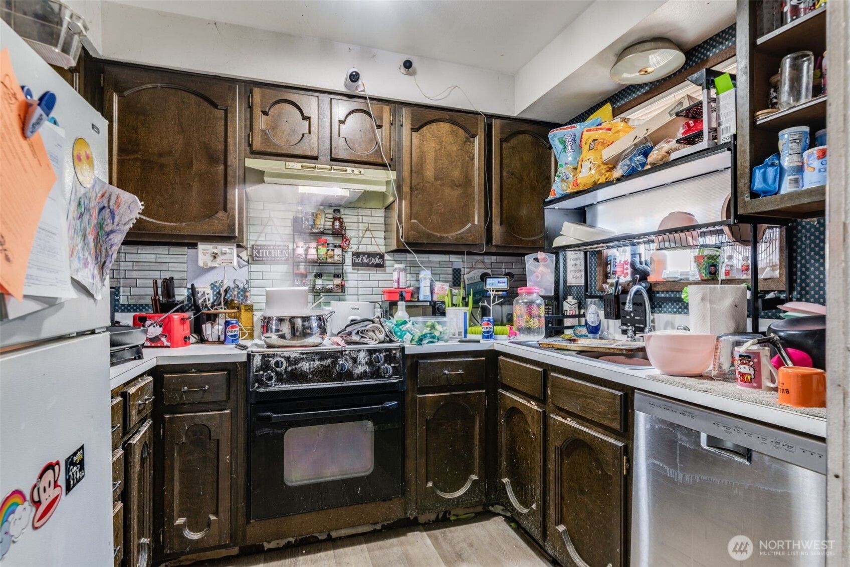 1602 Delaware Street Longview, WA 98632 - Photo 26 of 40 a kitchen with stainless steel appliances granite countertop a sink and a stove