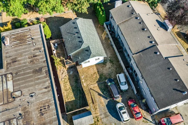an aerial view of a house with a yard