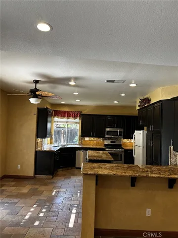 a view of a room with wooden floor and a window