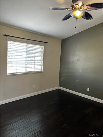 a bathroom with a granite countertop sink a mirror and shower