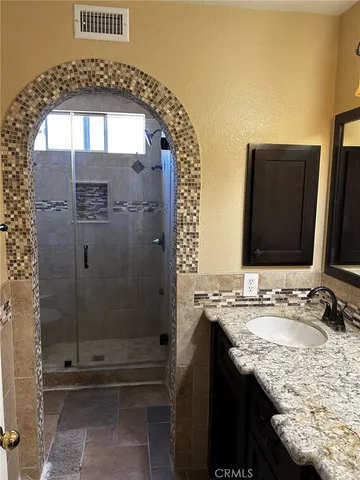 a view of a livingroom with furniture and staircase