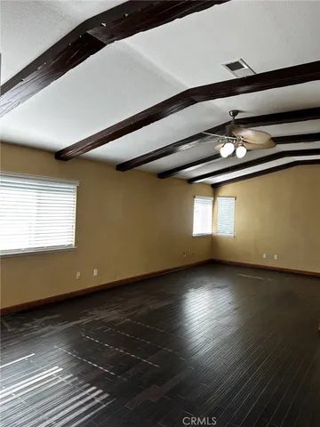 a bathroom with a granite countertop sink a toilet and bathtub