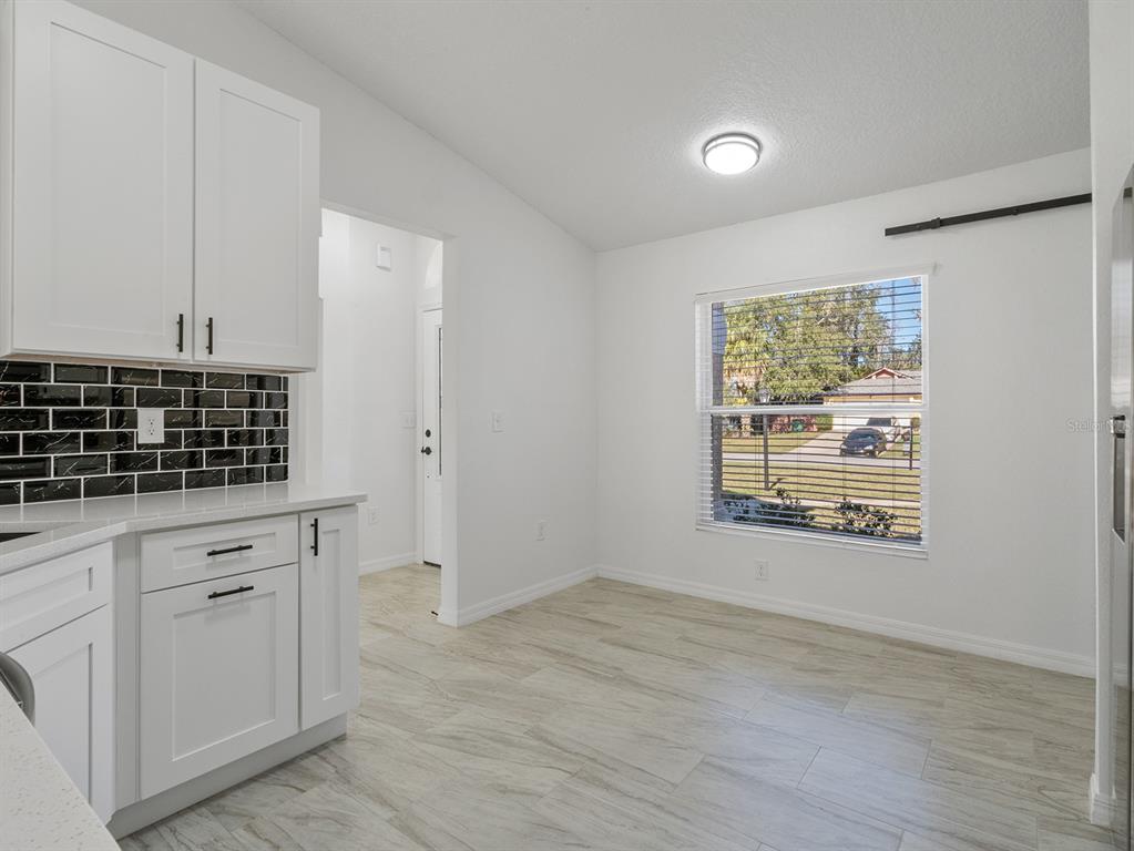 3215 Colusa Street Deltona, FL 32738 - Photo 20 of 32 a view of cabinets and window