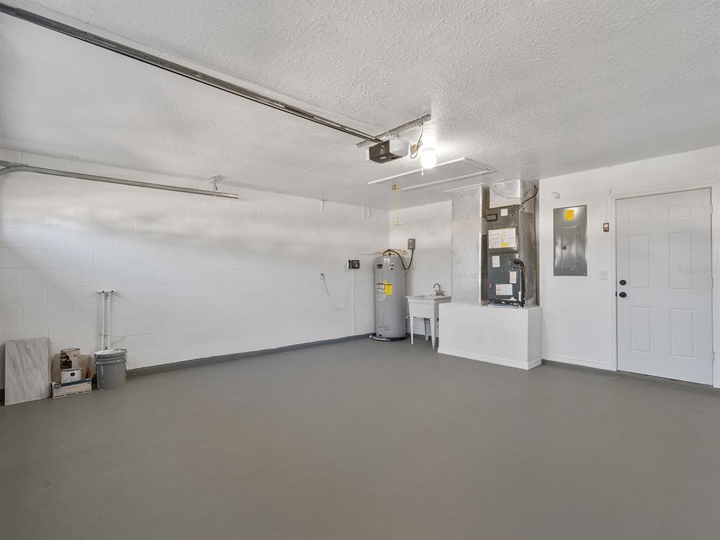 3215 Colusa Street Deltona, FL 32738 - Photo 30 of 32 a view of a livingroom with wooden floor and a ceiling fan