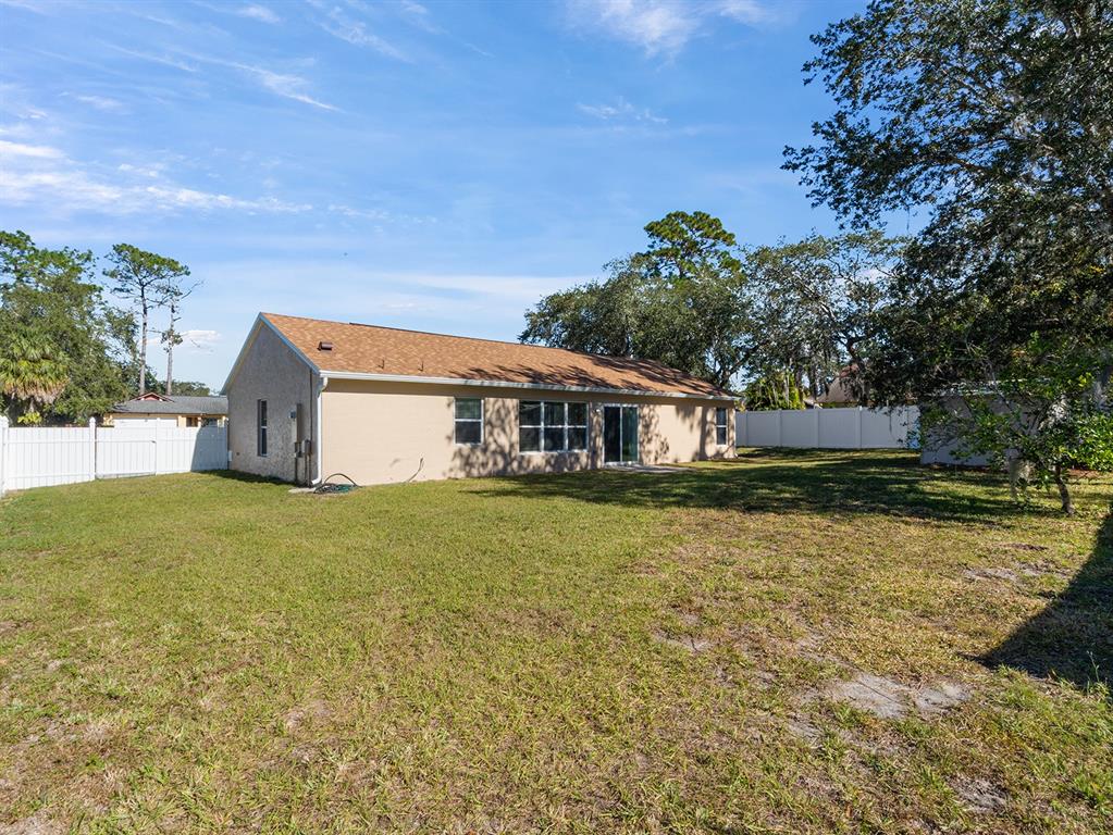 3215 Colusa Street Deltona, FL 32738 - Photo 31 of 32 a house view with a garden space