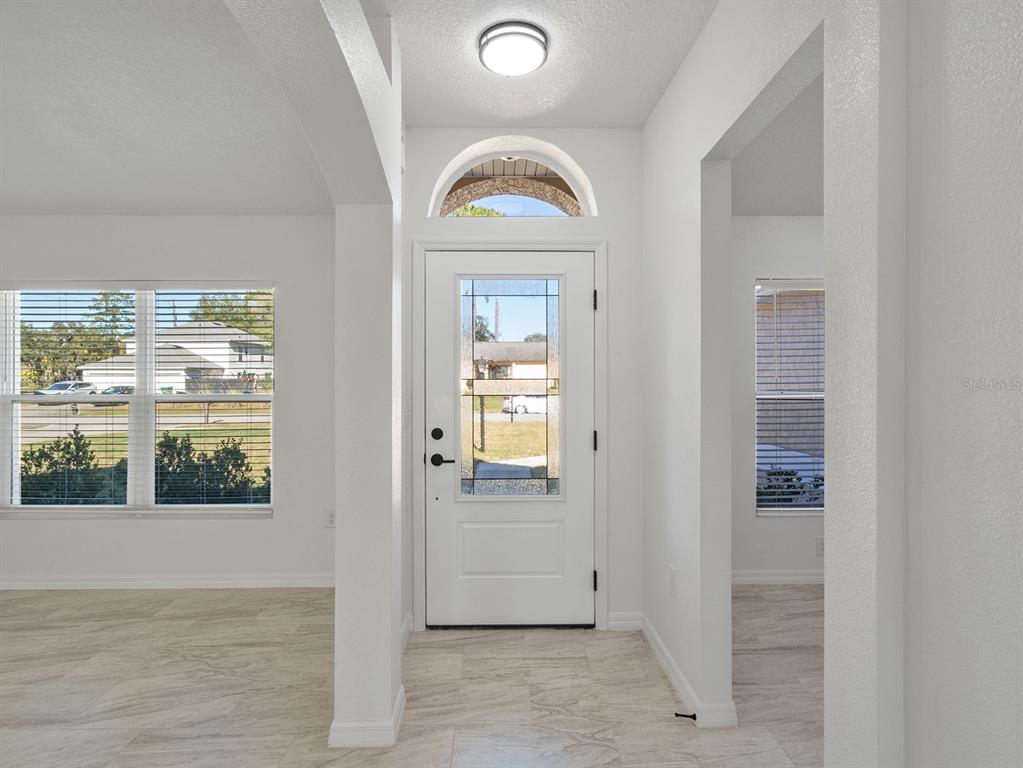 3215 Colusa Street Deltona, FL 32738 - Photo 4 of 32 an empty room with windows and closet