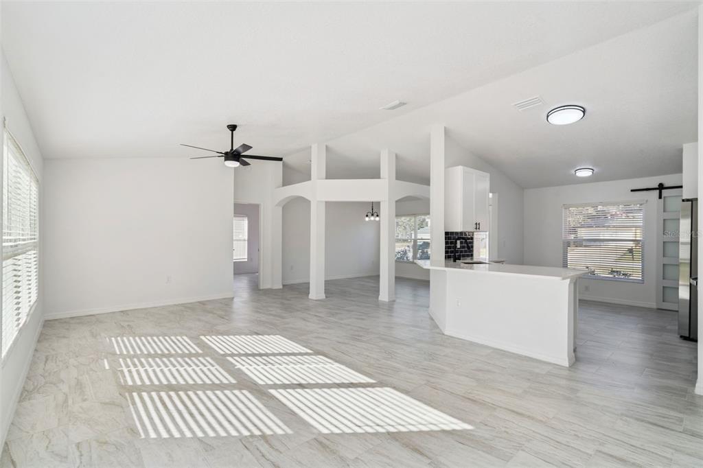 3215 Colusa Street Deltona, FL 32738 - Photo 8 of 32 a living room with furniture and a fireplace