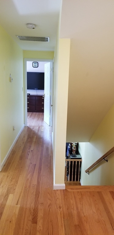 403 South Main Street, Unit 1 Sharon, MA 02067 - Photo 13 of 16 a view of a hallway with wooden floor