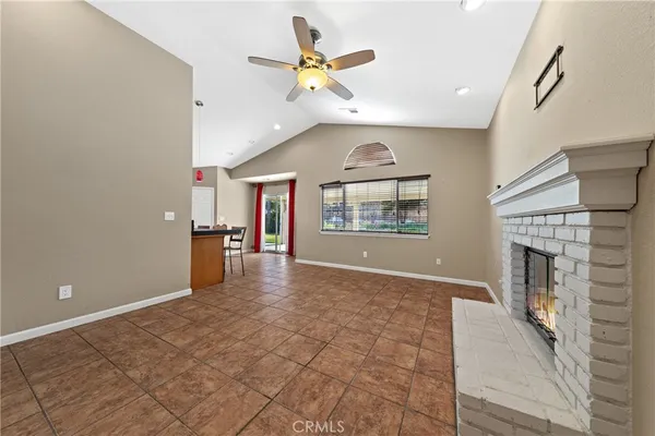 a dining room with stainless steel appliances kitchen island granite countertop a dining table and chairs