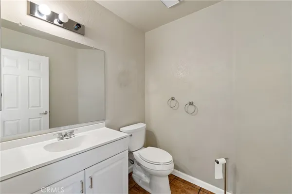 a view of an empty room with window and stairs