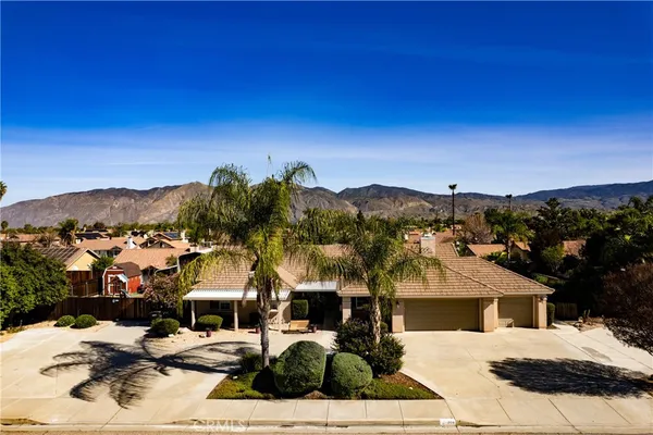 an aerial view of houses with outdoor space