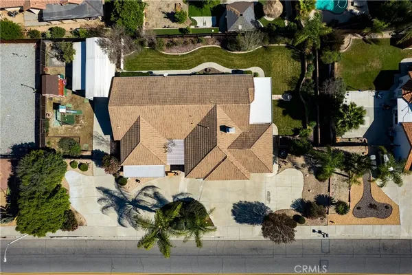 an aerial view of a house with a yard