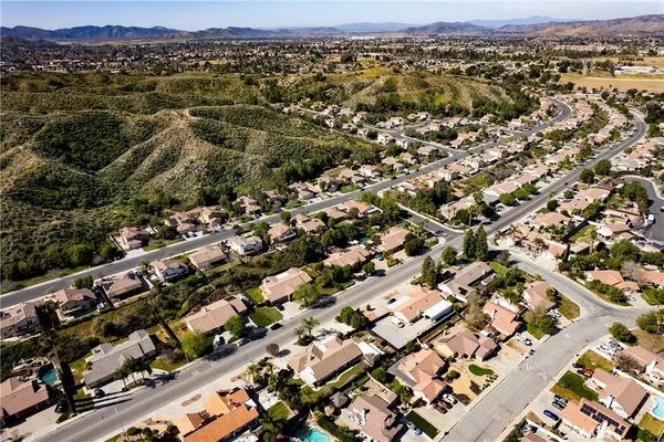an aerial view of residential house and sandy dunes