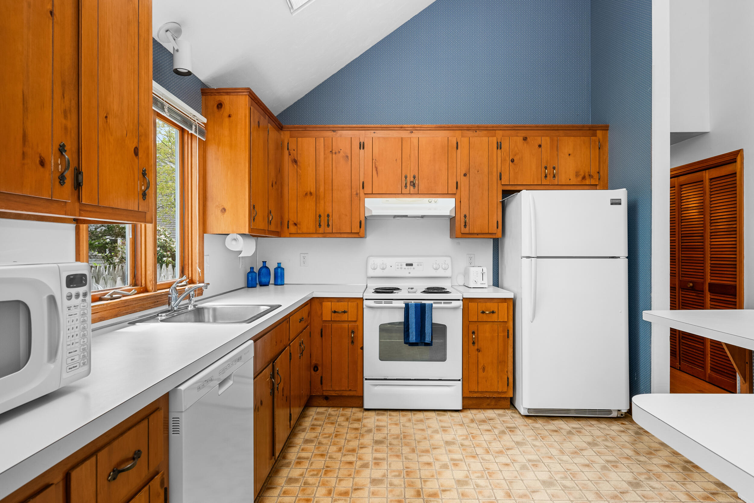 5 Blueberry Island Road Orleans, MA 02653 - Photo 11 of 39 a kitchen with stainless steel appliances granite countertop a refrigerator a sink a stove and a refrigerator