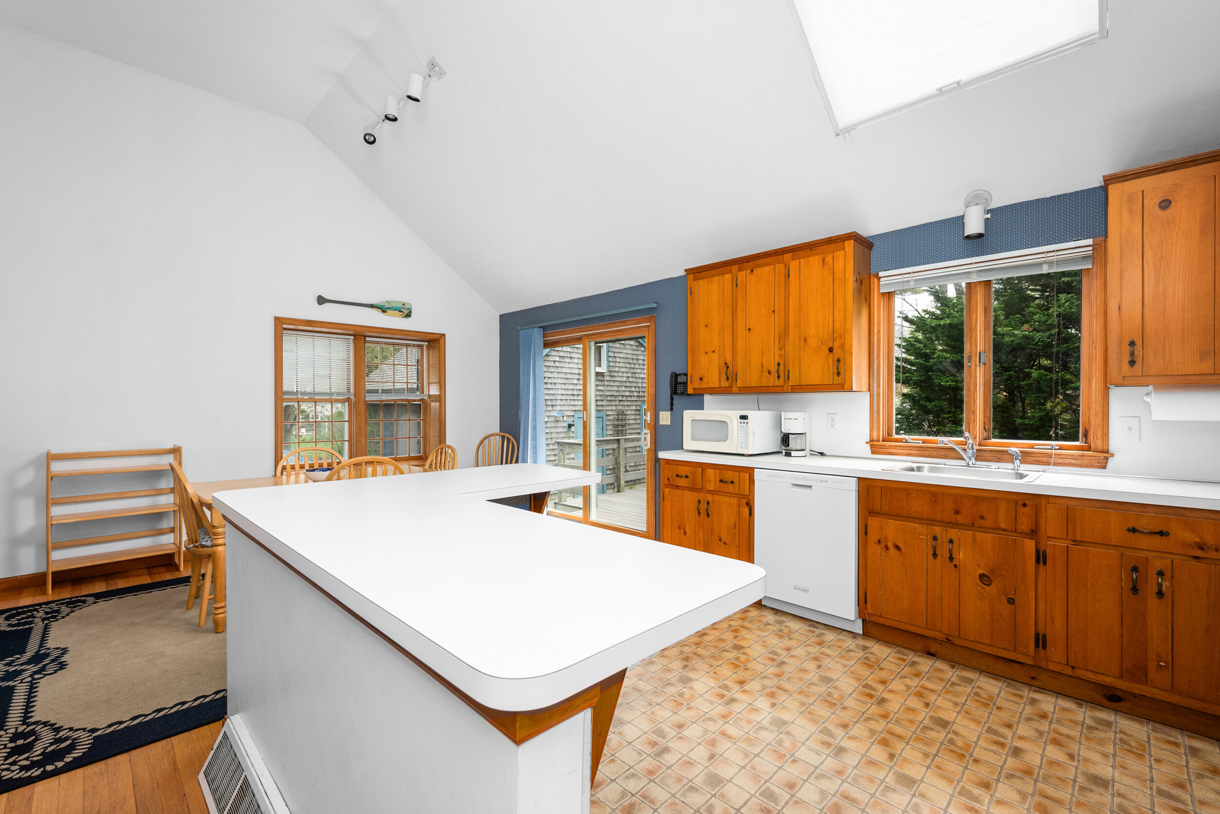 5 Blueberry Island Road Orleans, MA 02653 - Photo 12 of 39 a kitchen with a stove a sink and a refrigerator