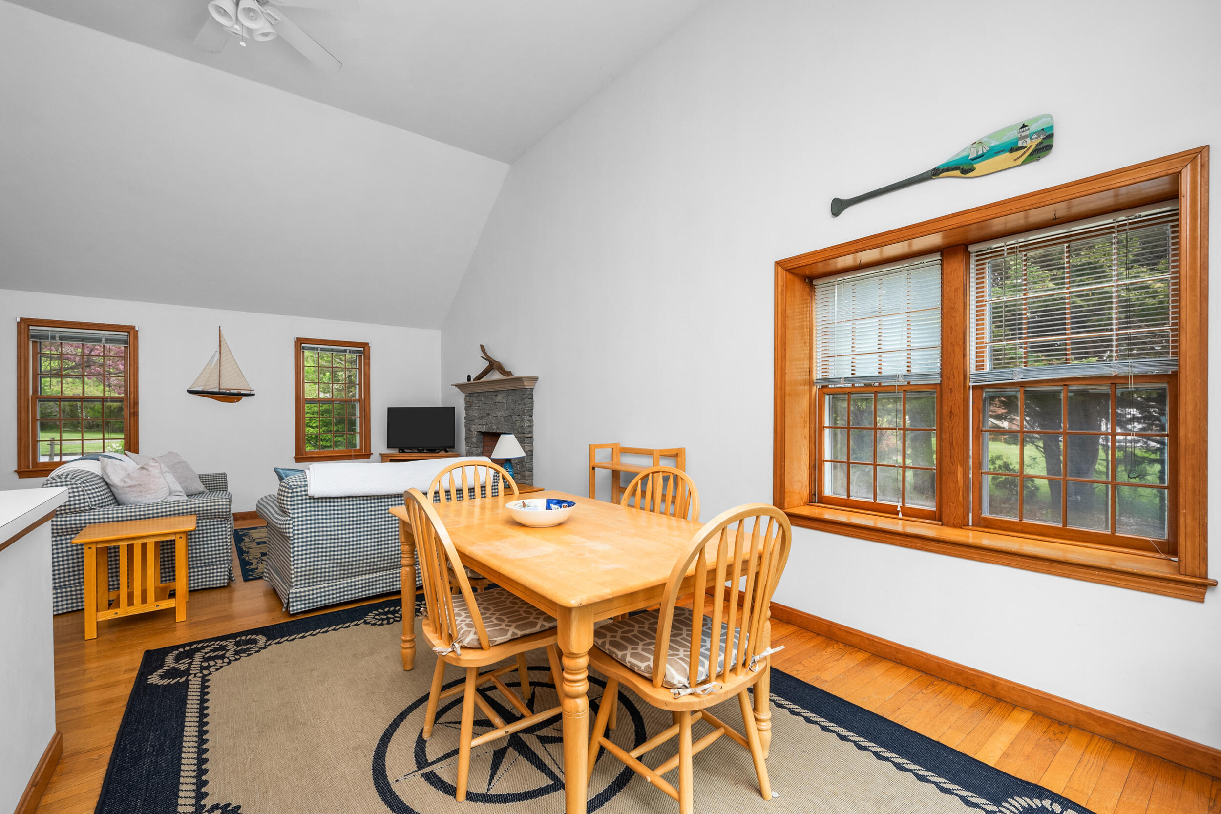 5 Blueberry Island Road Orleans, MA 02653 - Photo 13 of 39 a view of a dining room with furniture wooden floor and a large window