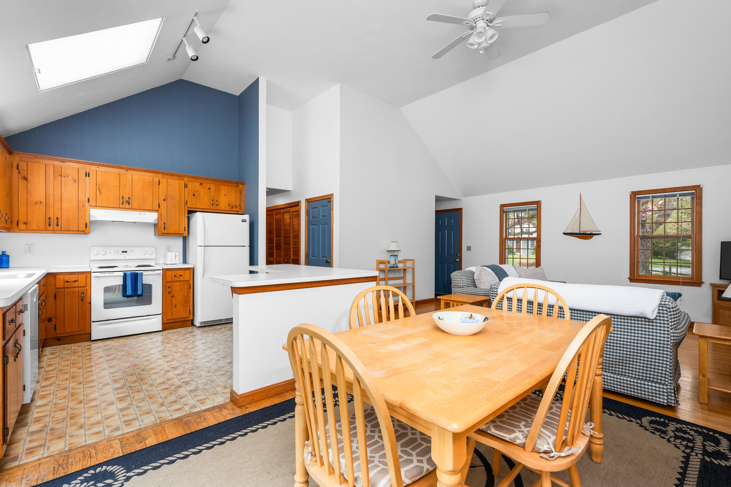 5 Blueberry Island Road Orleans, MA 02653 - Photo 14 of 39 a dining room with furniture a large window and wooden floor