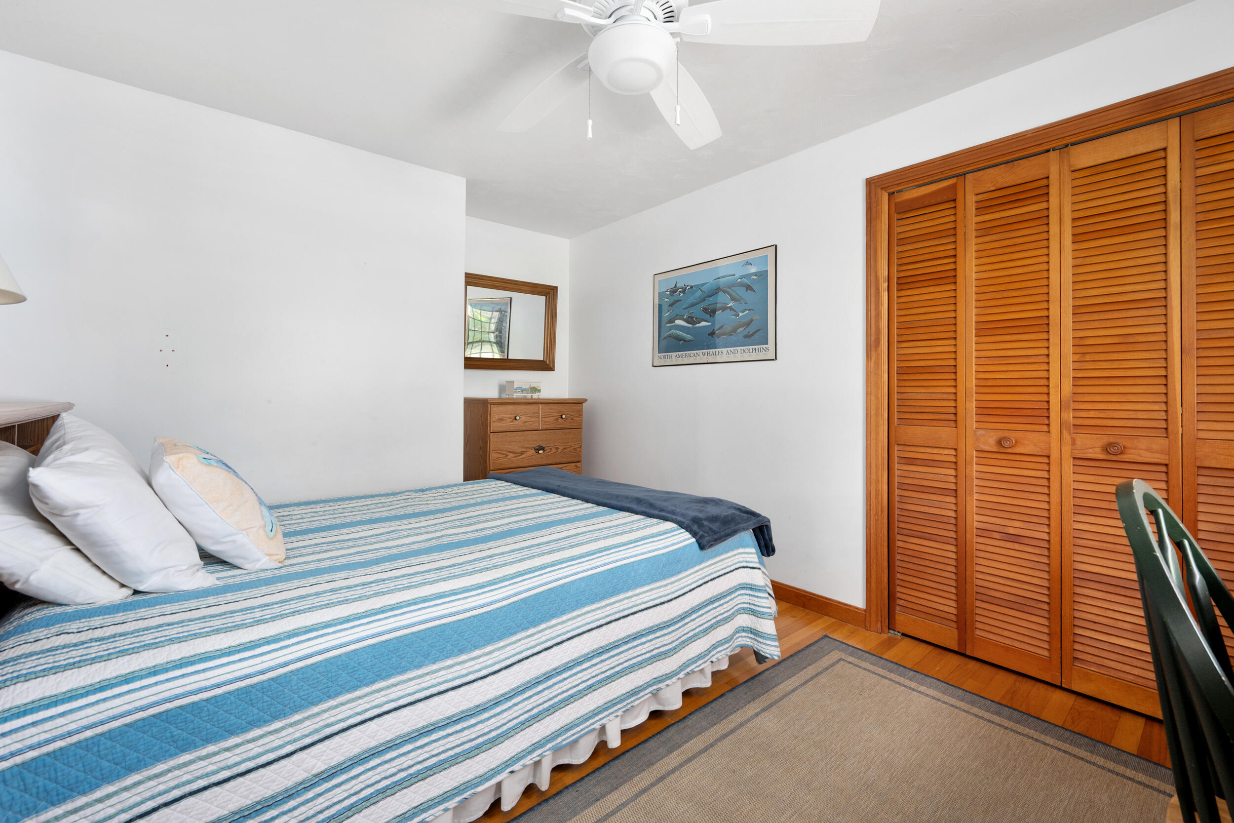 5 Blueberry Island Road Orleans, MA 02653 - Photo 17 of 39 a bedroom with a bed and a large window