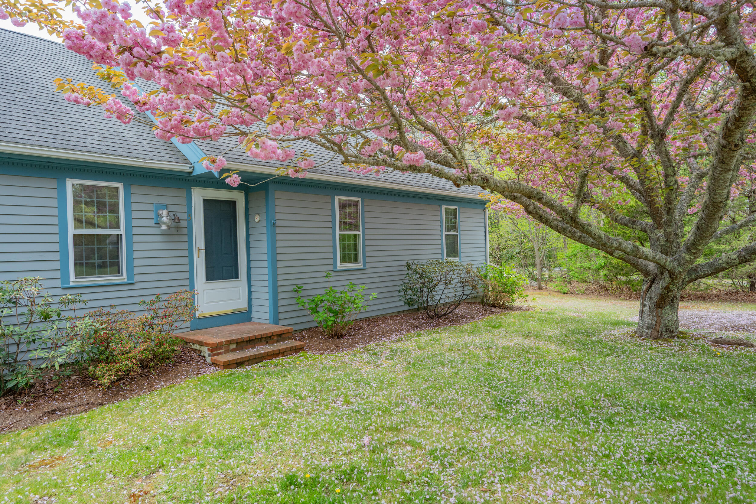5 Blueberry Island Road Orleans, MA 02653 - Photo 2 of 39 a front view of a house with garden