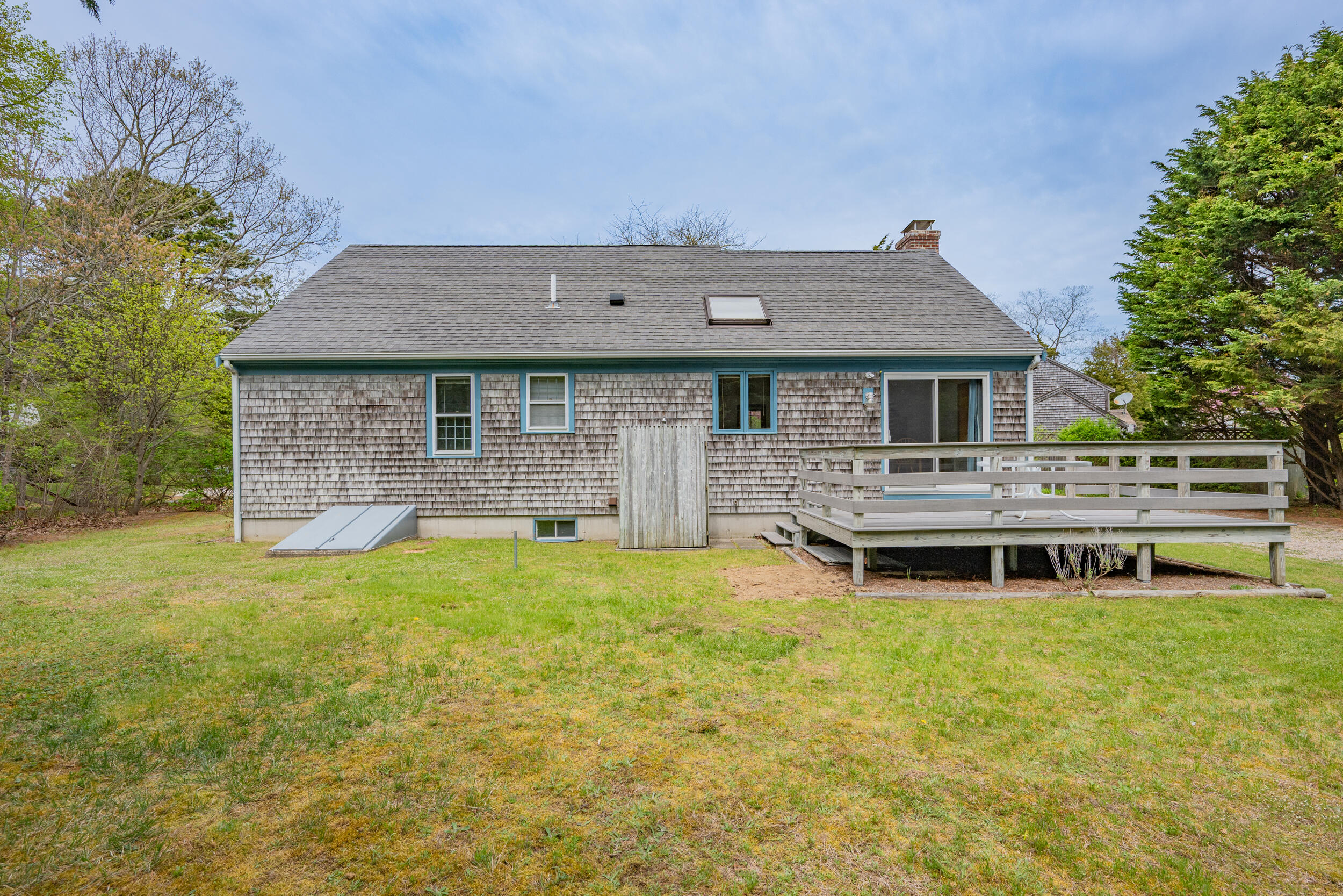 5 Blueberry Island Road Orleans, MA 02653 - Photo 25 of 39 a front view of a house with yard and green space