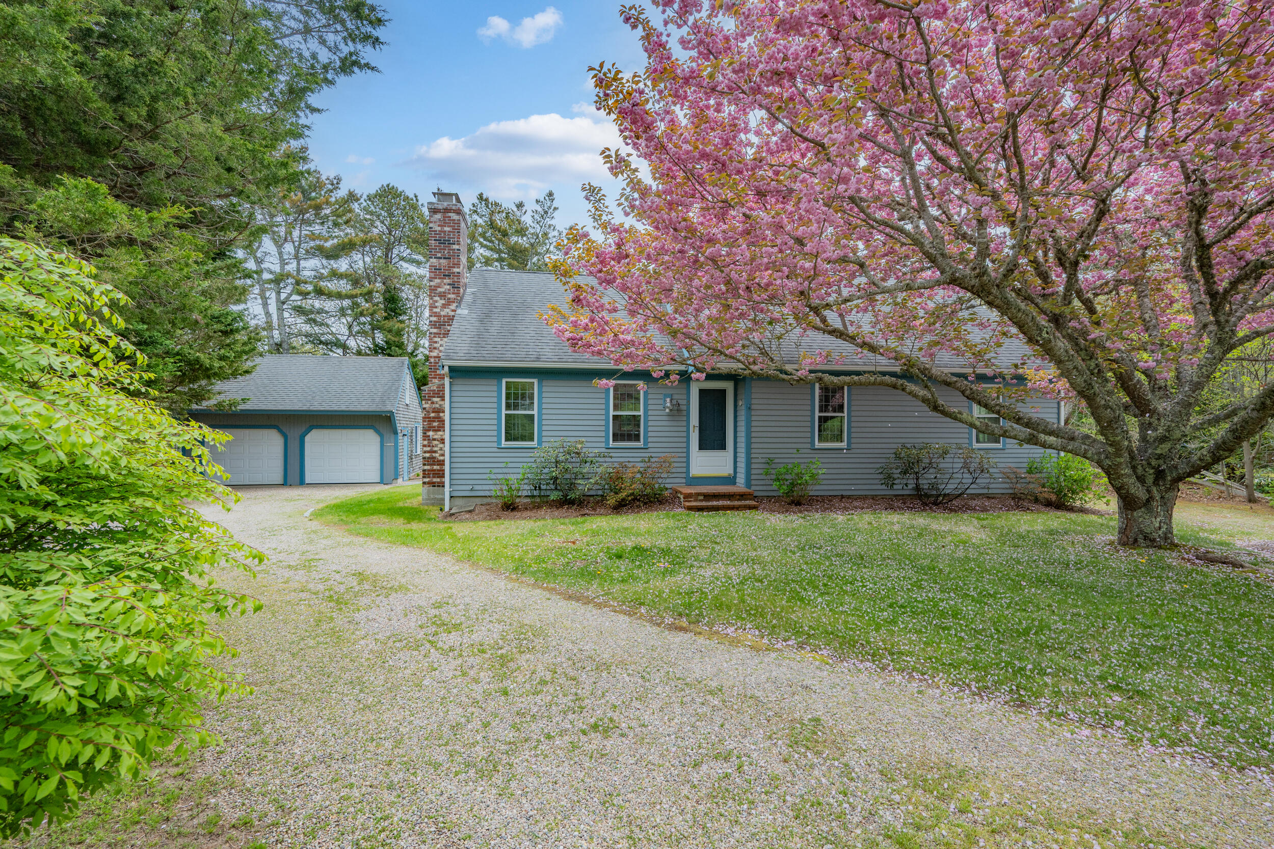5 Blueberry Island Road Orleans, MA 02653 - Photo 3 of 39 a front view of a house with garden