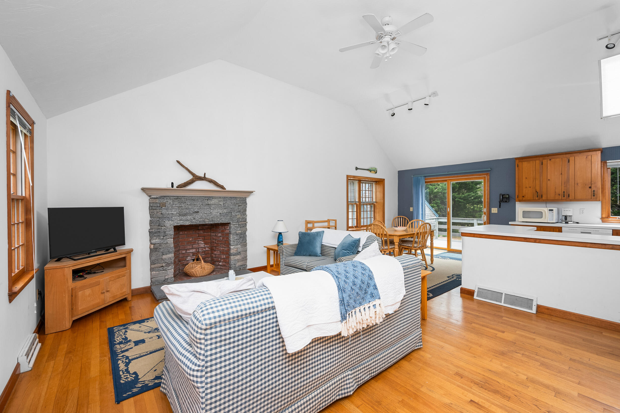 5 Blueberry Island Road Orleans, MA 02653 - Photo 5 of 39 a living room with fireplace furniture and a flat screen tv