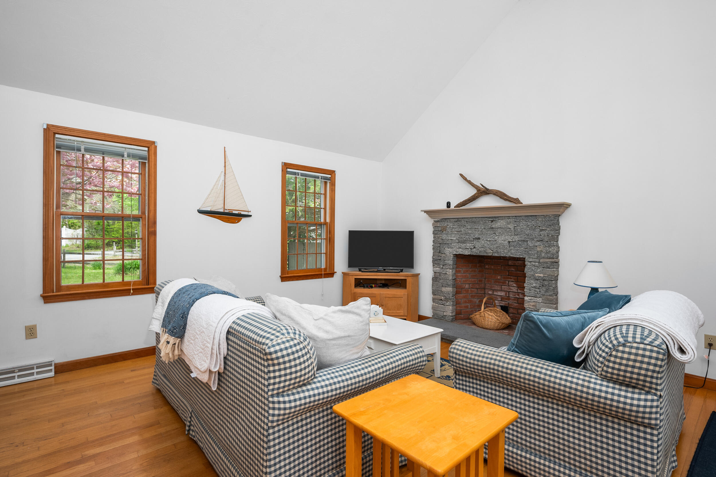 5 Blueberry Island Road Orleans, MA 02653 - Photo 7 of 39 a living room with furniture and a fireplace