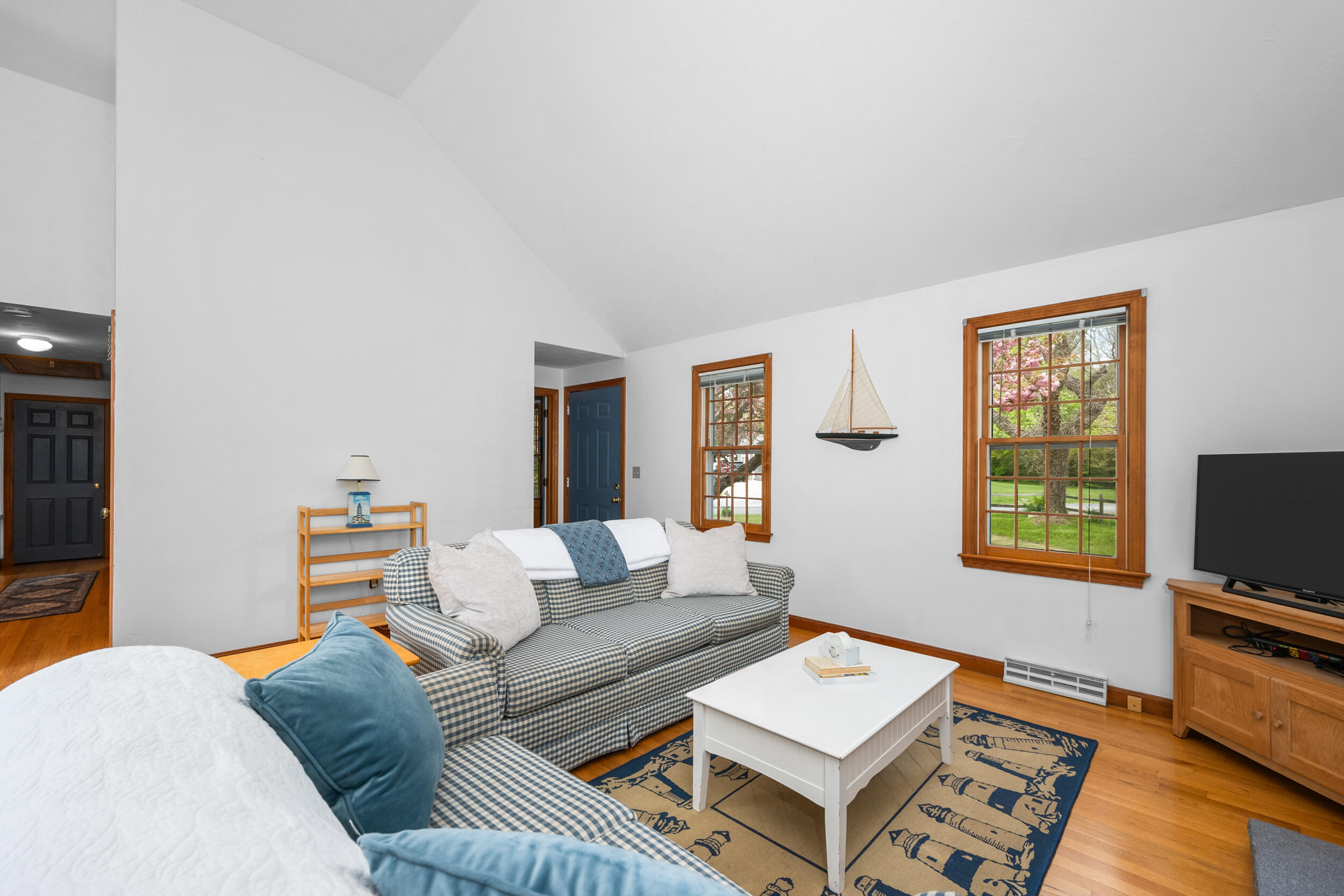 5 Blueberry Island Road Orleans, MA 02653 - Photo 8 of 39 a living room with furniture and a flat screen tv