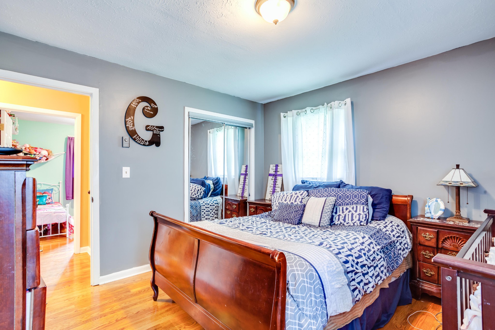 1283 Laurel Road Clinton, TN 37716 - Photo 11 of 29 a bedroom with a bed and a chandelier
