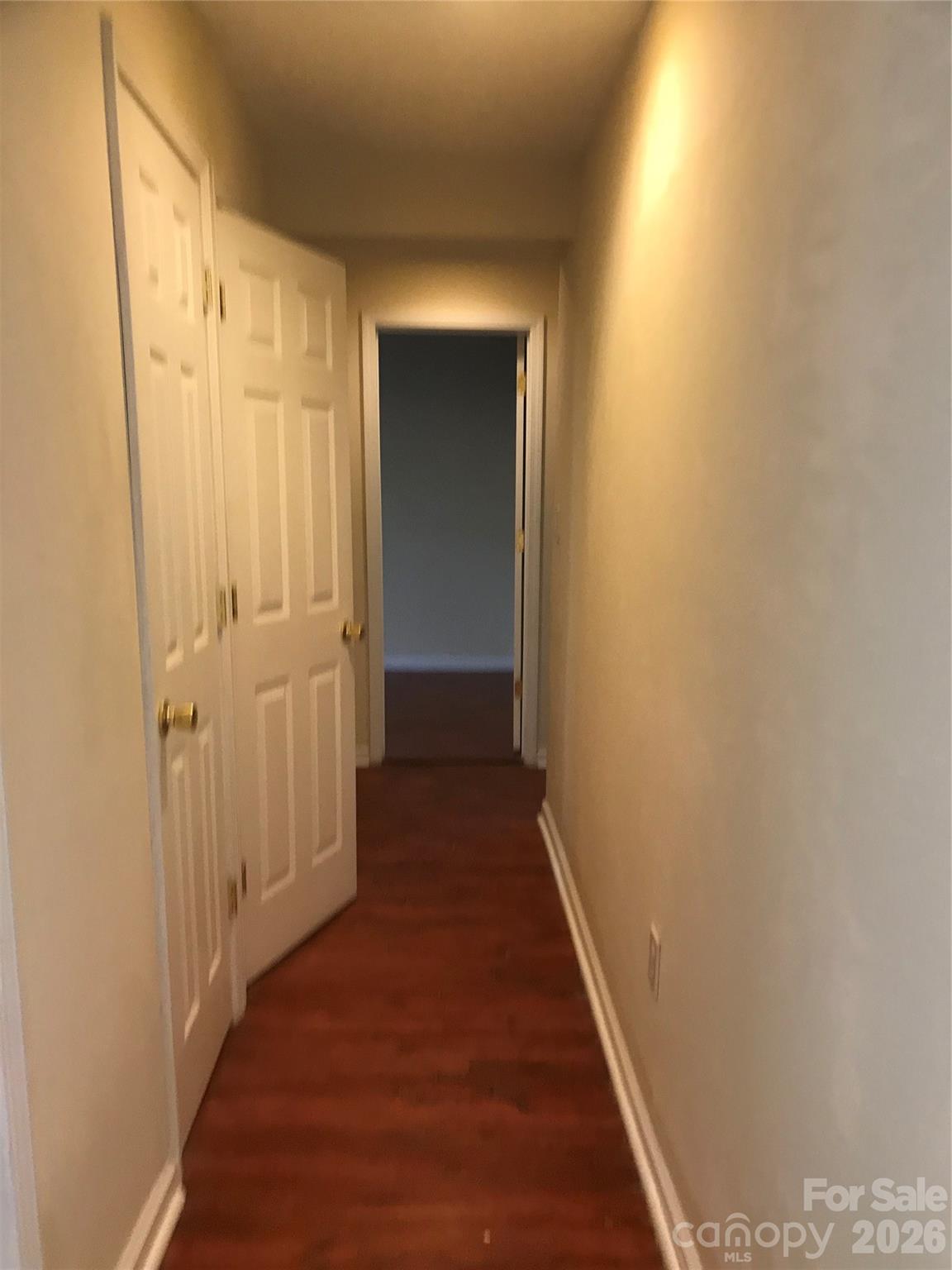 545 Avery Creek Road Arden, NC 28704 - Photo 16 of 35 a view of a hallway with wooden floor