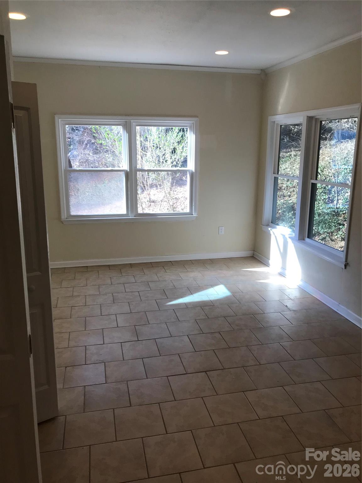 545 Avery Creek Road Arden, NC 28704 - Photo 18 of 35 a view of empty room with windows