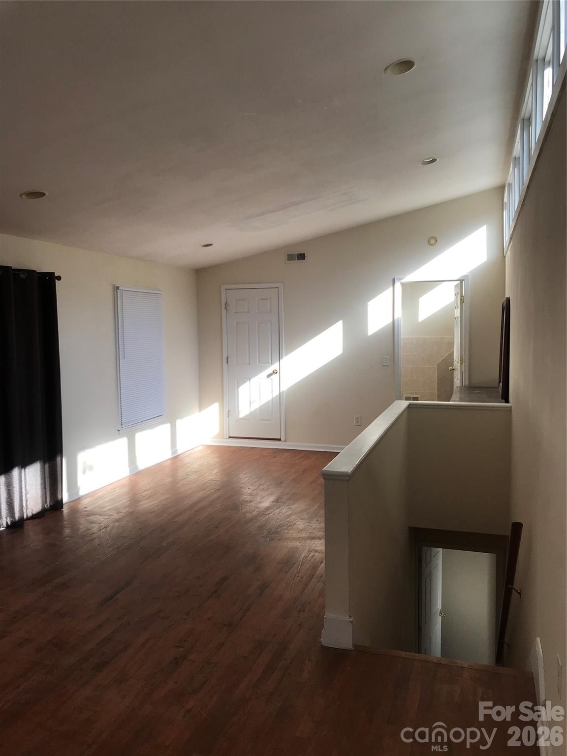 545 Avery Creek Road Arden, NC 28704 - Photo 23 of 35 a view of a hallway with wooden floor