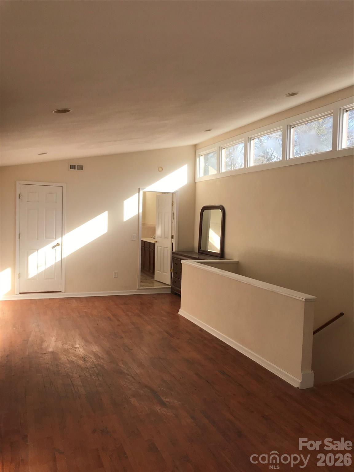 545 Avery Creek Road Arden, NC 28704 - Photo 24 of 35 a view of a hallway with wooden floor