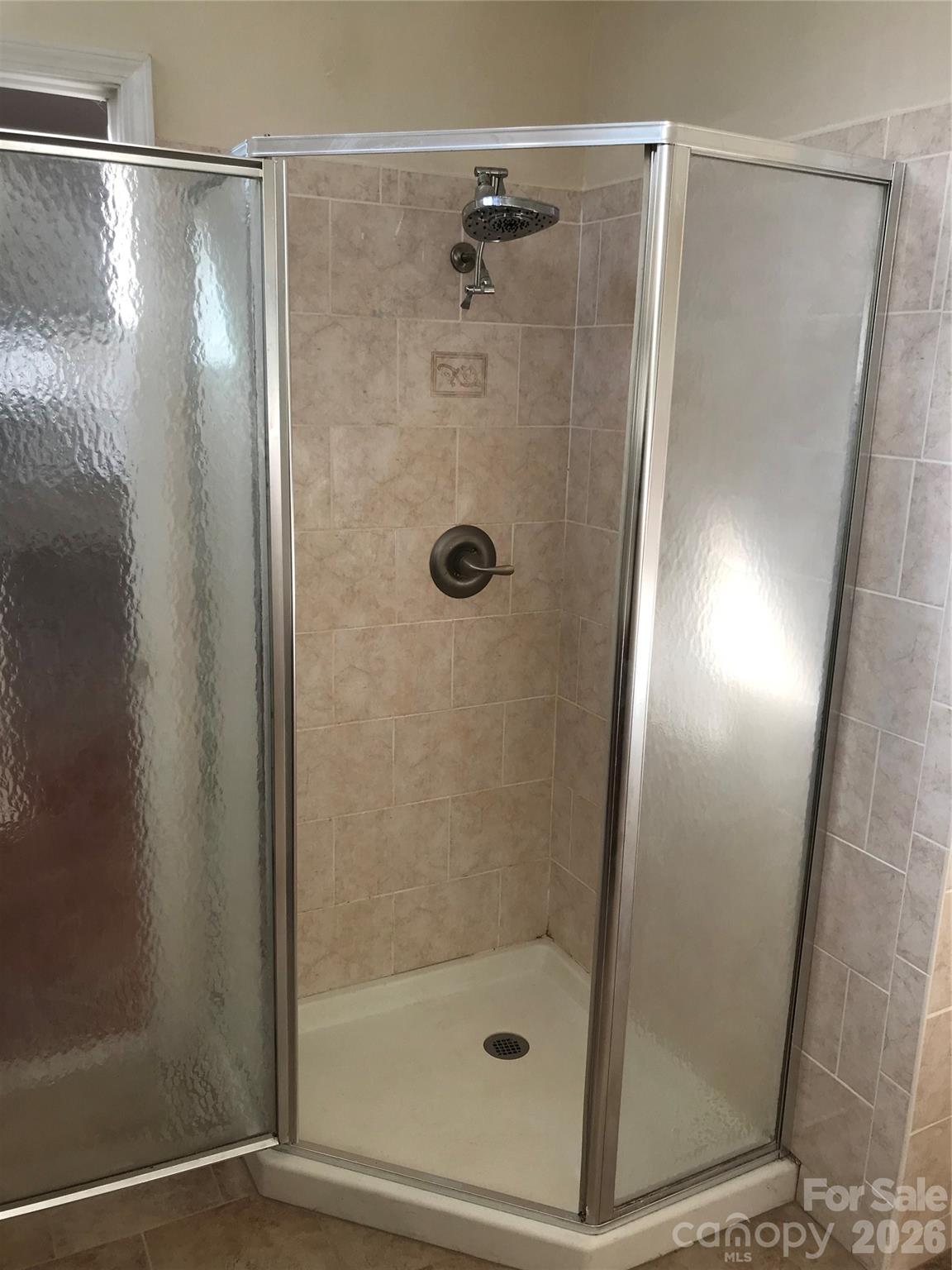 545 Avery Creek Road Arden, NC 28704 - Photo 27 of 35 a bathroom with a shower