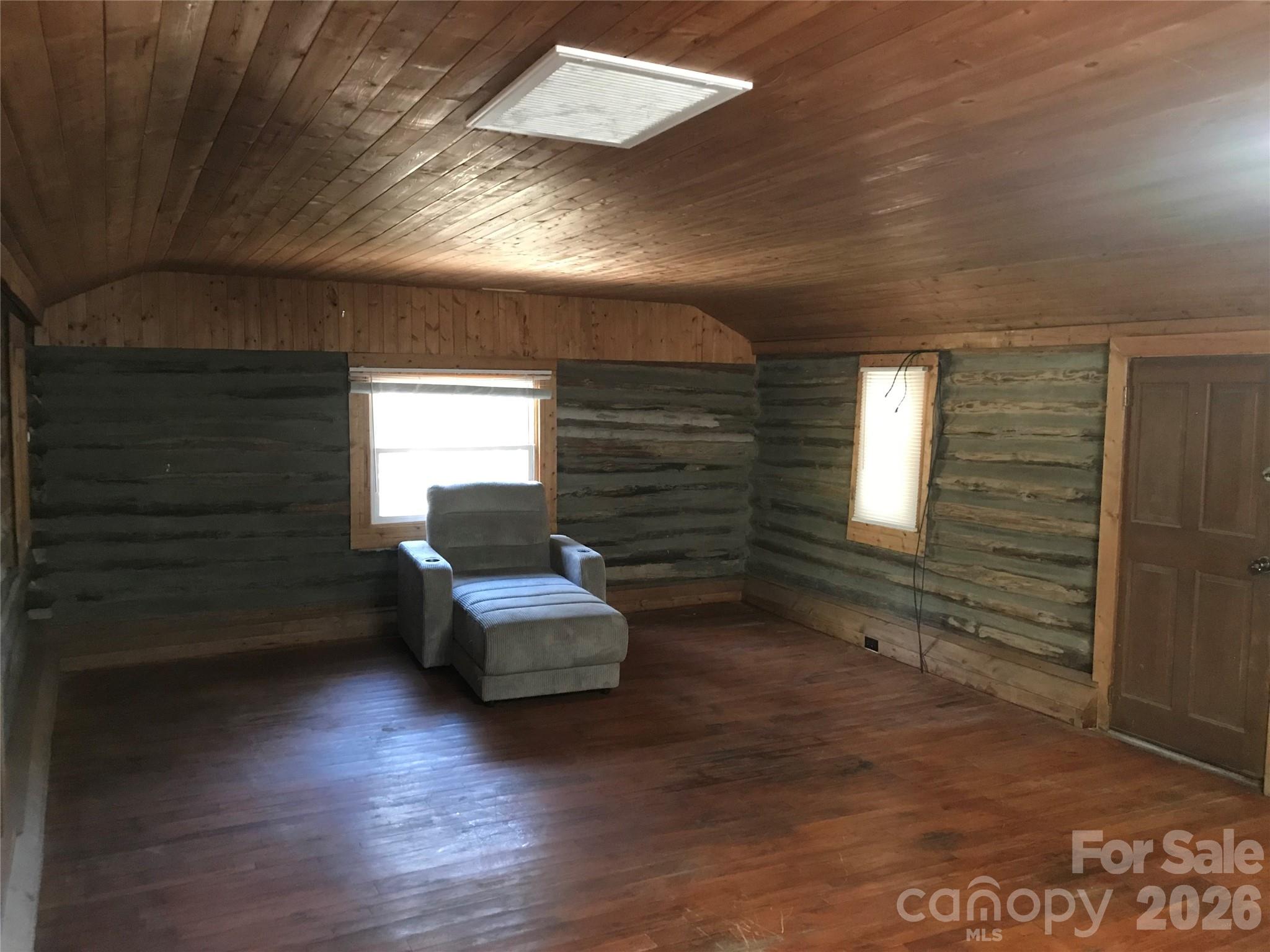 545 Avery Creek Road Arden, NC 28704 - Photo 30 of 35 a living room with couches potted plants with wooden floor