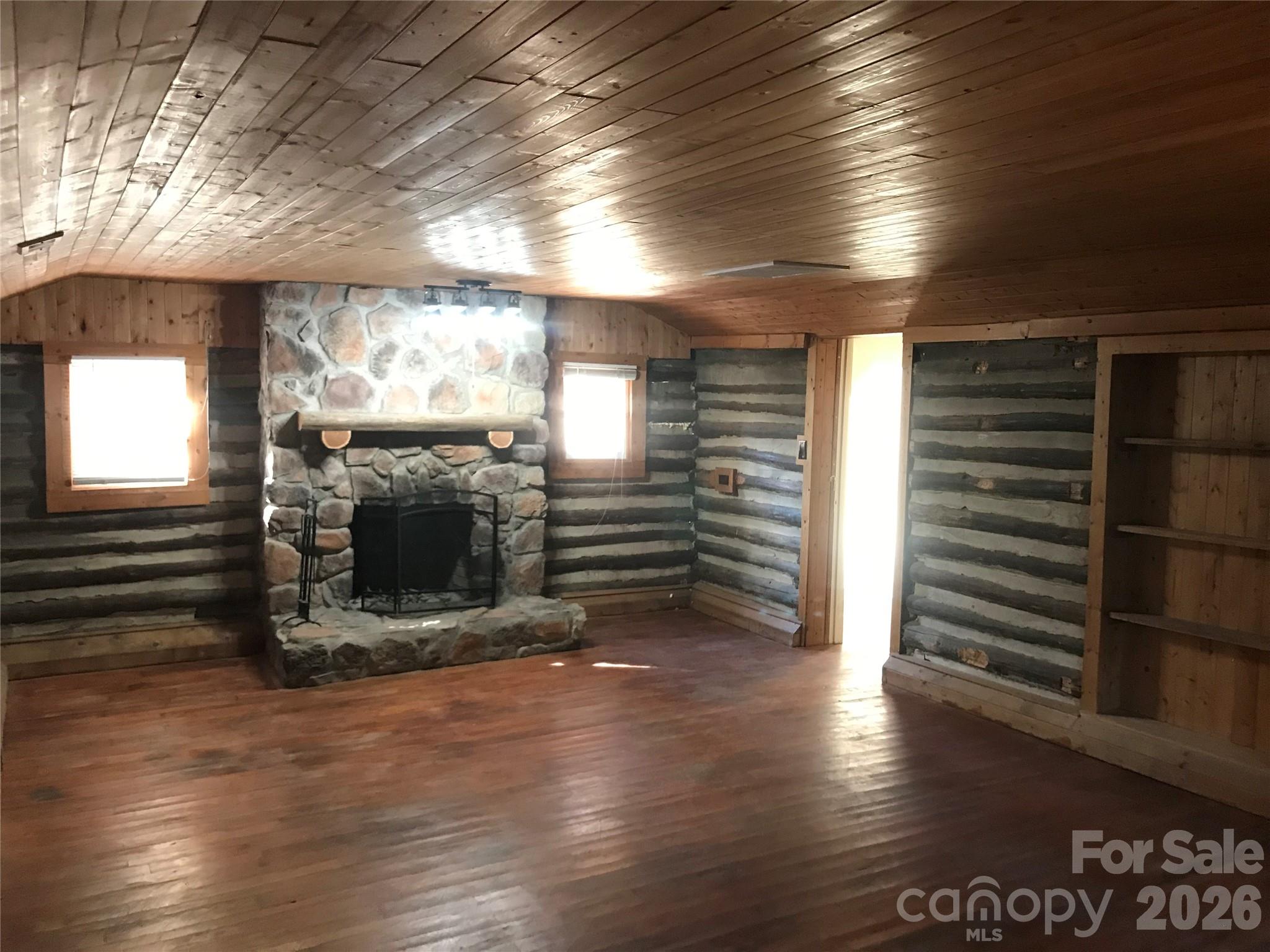 545 Avery Creek Road Arden, NC 28704 - Photo 31 of 35 a view of fireplace and wooden floor