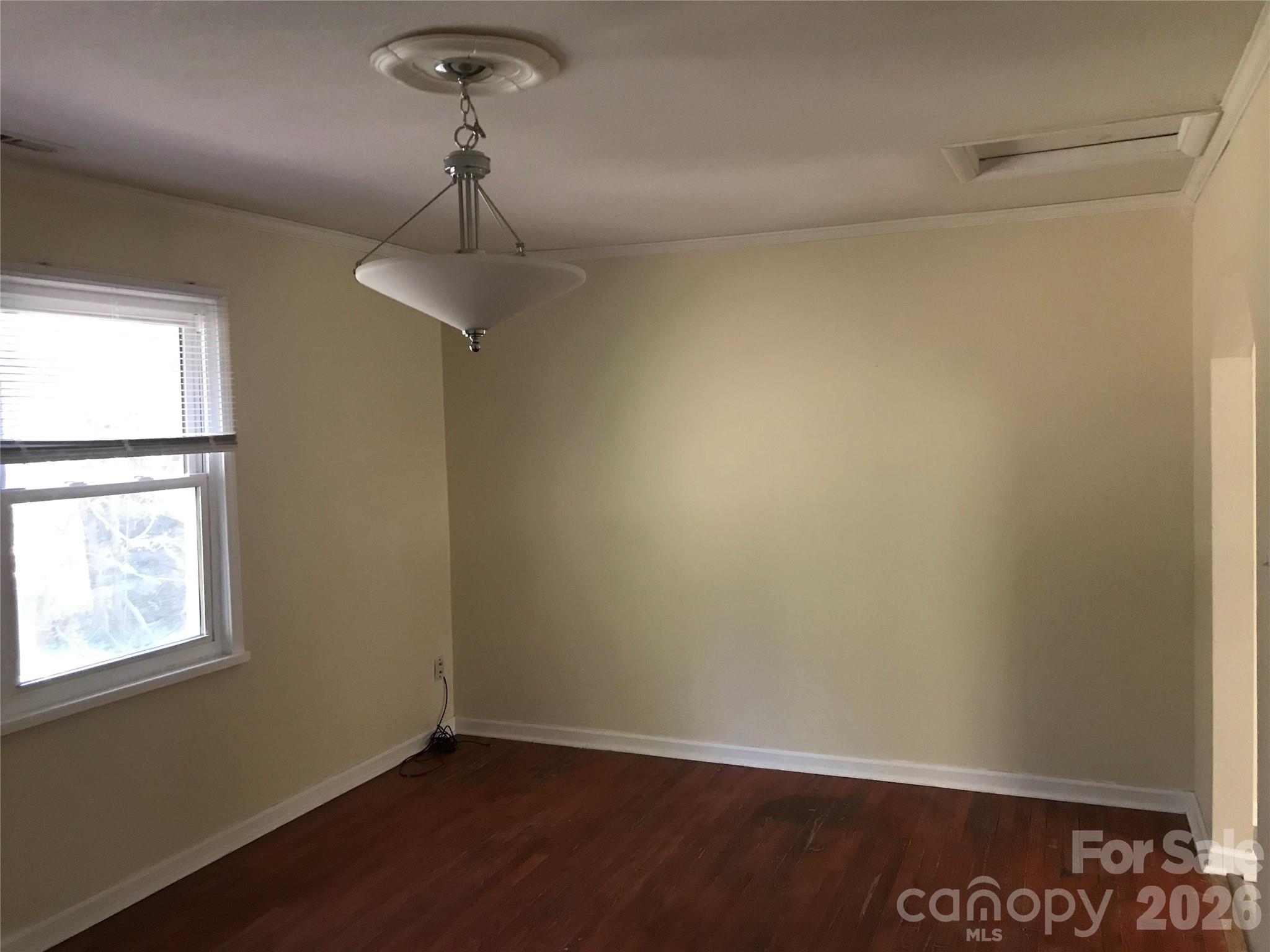 545 Avery Creek Road Arden, NC 28704 - Photo 9 of 35 a view of an empty room with a window