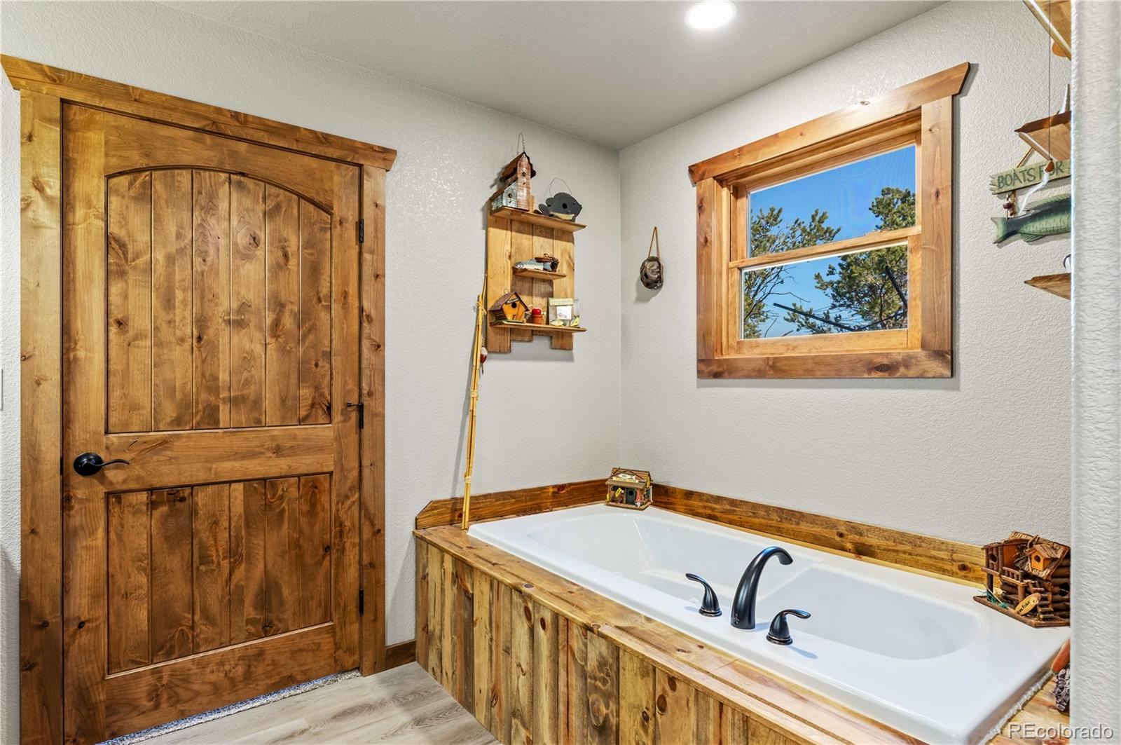 1310 Sunrise Ridge Cotopaxi, CO 81223 - Photo 28 of 50 a bathroom with a tub sink and mirror
