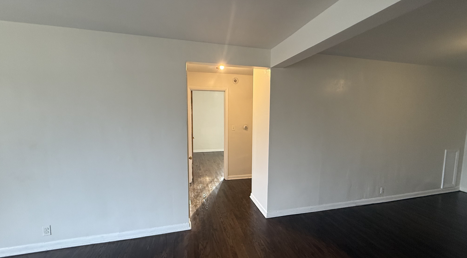1014 Edwards Street, Unit 1 Waukegan, IL 60085 - Photo 8 of 10 an empty room with wooden floor and closet