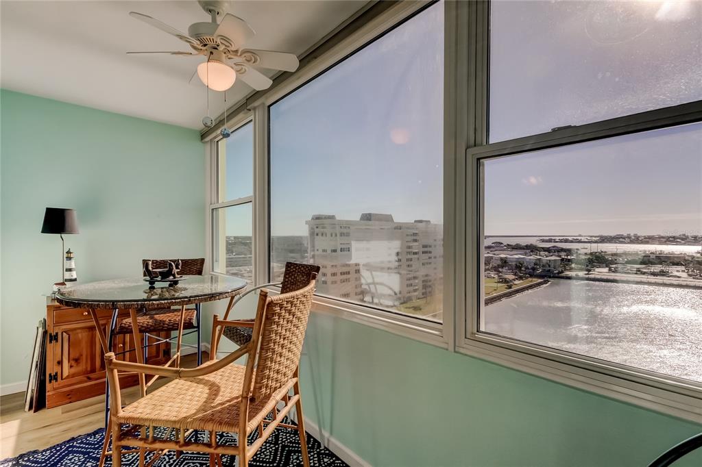 4775 Cove Circle, Unit 1105 St. Petersburg, FL 33708 - Photo 17 of 40 a view of a dining room with furniture window and outside view