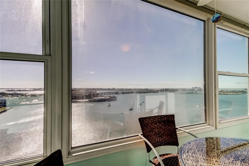 4775 Cove Circle, Unit 1105 St. Petersburg, FL 33708 - Photo 20 of 40 a view of a chair and table in the balcony