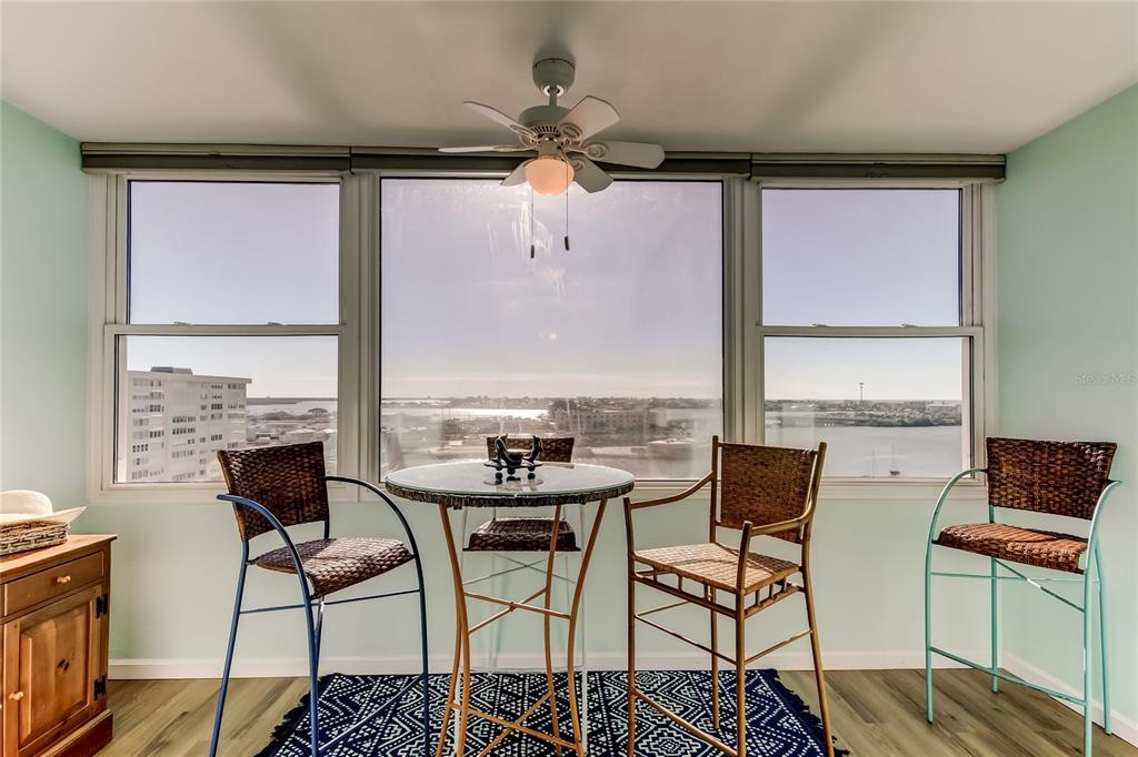 4775 Cove Circle, Unit 1105 St. Petersburg, FL 33708 - Photo 2 of 40 a view of a dining room with furniture window and outside view