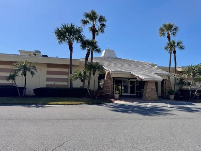 4775 Cove Circle, Unit 1105 St. Petersburg, FL 33708 - Photo 26 of 40 a front view of a house with a garden
